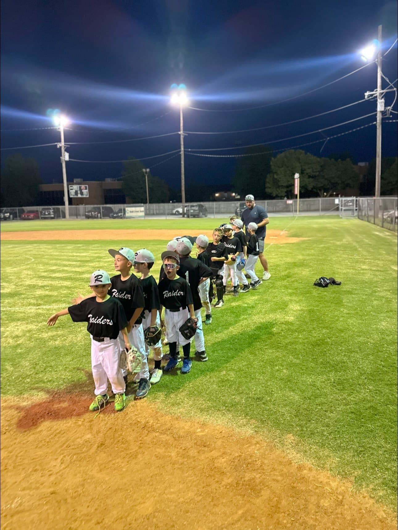 An OKC Raiders team on the field